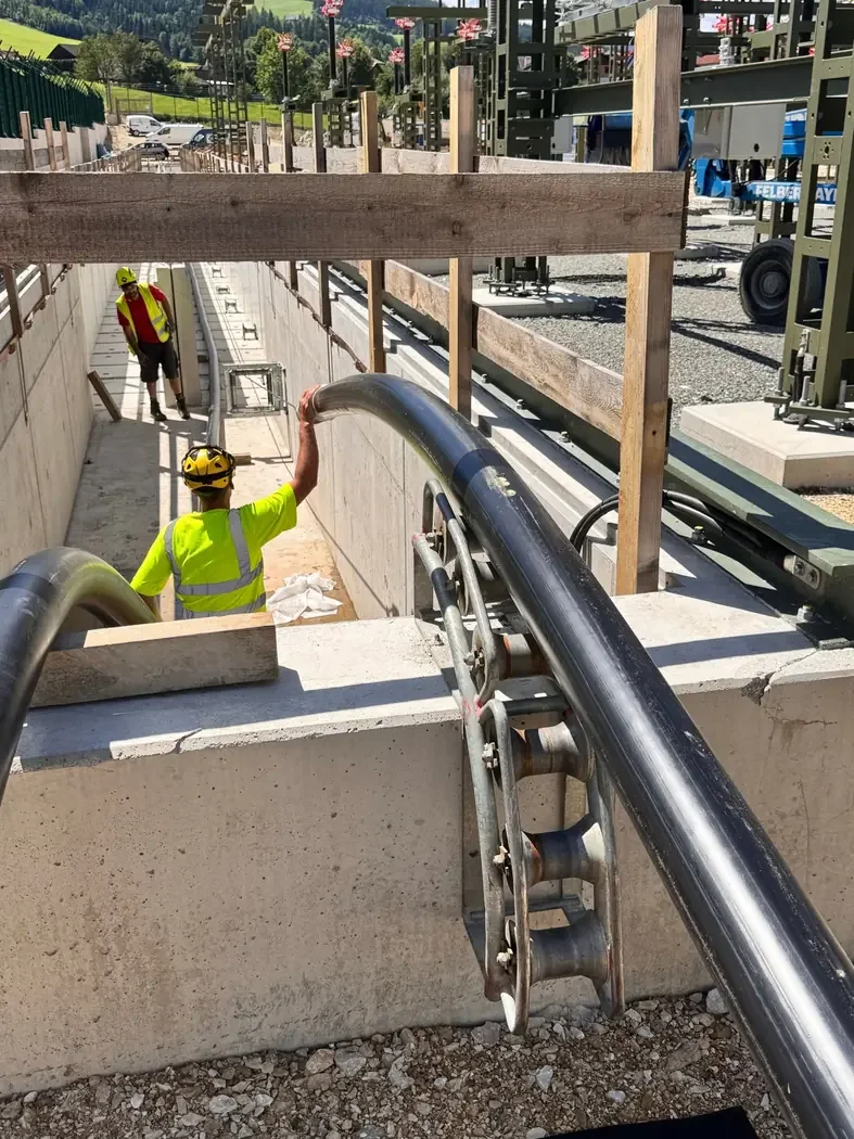 Employees pulling cables along a cable route